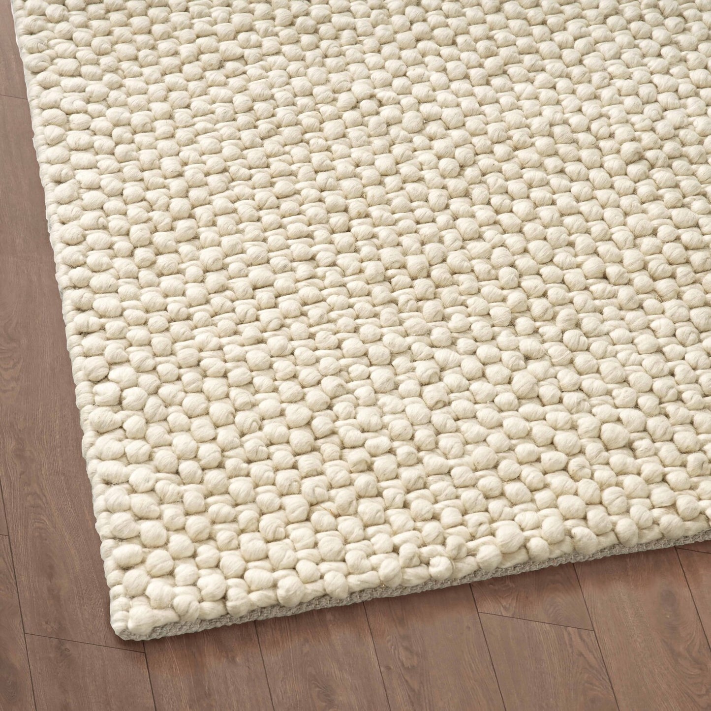 Close-up of a Mat for drawing room on a wooden floor