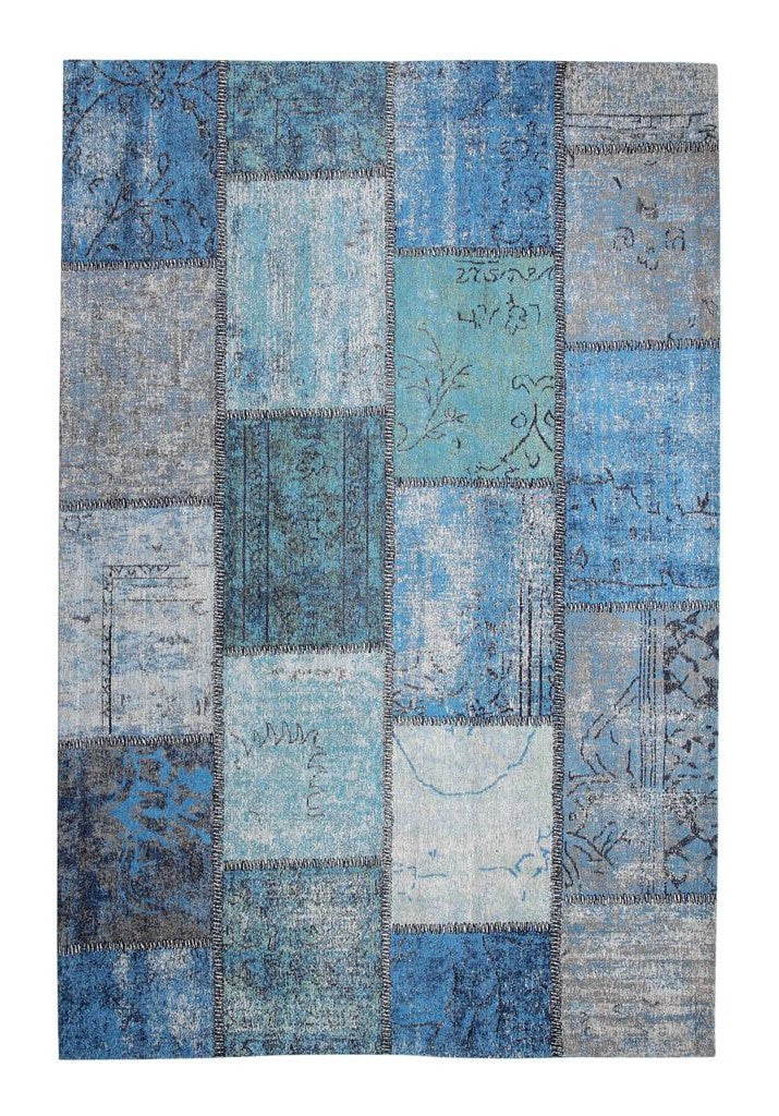 Patchwork area rug with blue and gray pattern on a white background