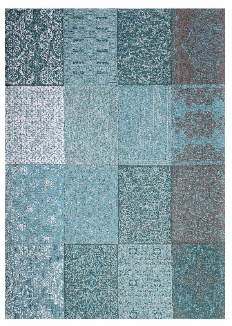 Patchwork area rug with blue and gray pattern on a white background